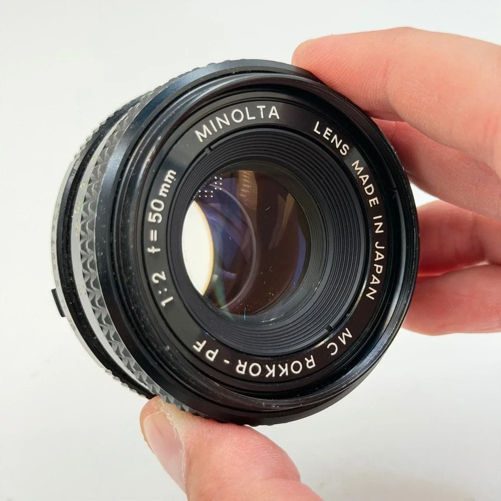 Minolta MC Rokkor-PF 50mm f/2 Lens with 55mm Skylight 1A Hood SR Mount 1126884